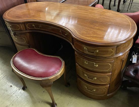 An Edwardian style mahogany kidney shaped dressing table, width 150cm, depth 64cm, height 77cm and stool